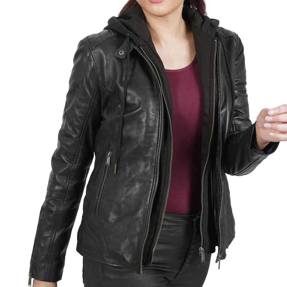 Woman wearing a black leather jacket with zippers over a burgundy top on white background