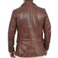 The back view of a man wearing a brown leather jacket.