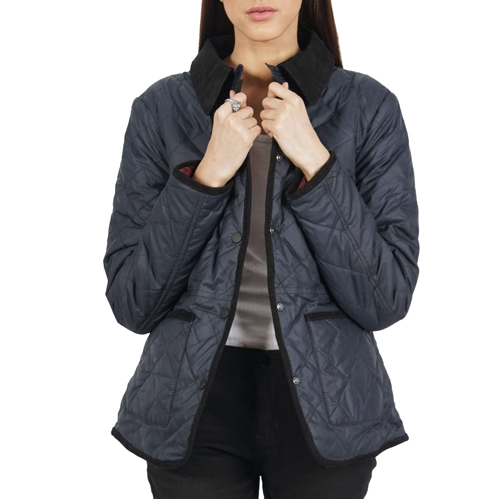 A woman donning a trendy blue quilted jacket.