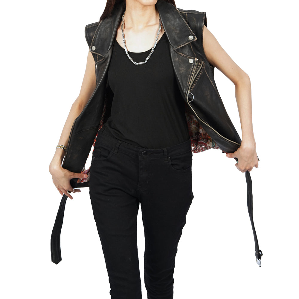 A woman wearing a Ash black leather vest Jacket.