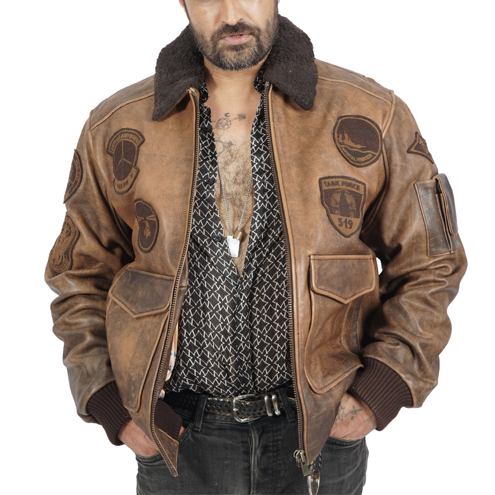 A man donning a bomber jacket in brown leather