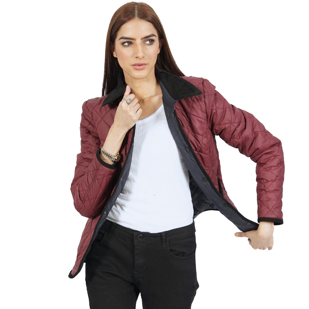  A woman wearing an Aria quilted jacket.