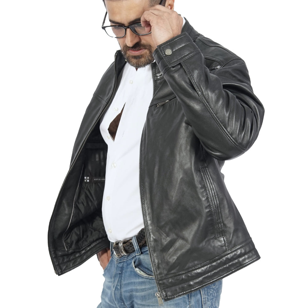 A man wearing a black leather jacket and jeans, exuding a cool and stylish vibe.