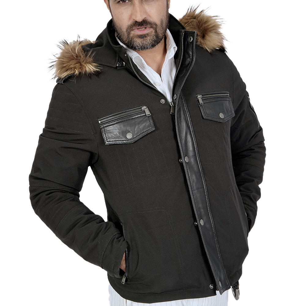 A stylish man donning a black jacket with a faux fur hodded
