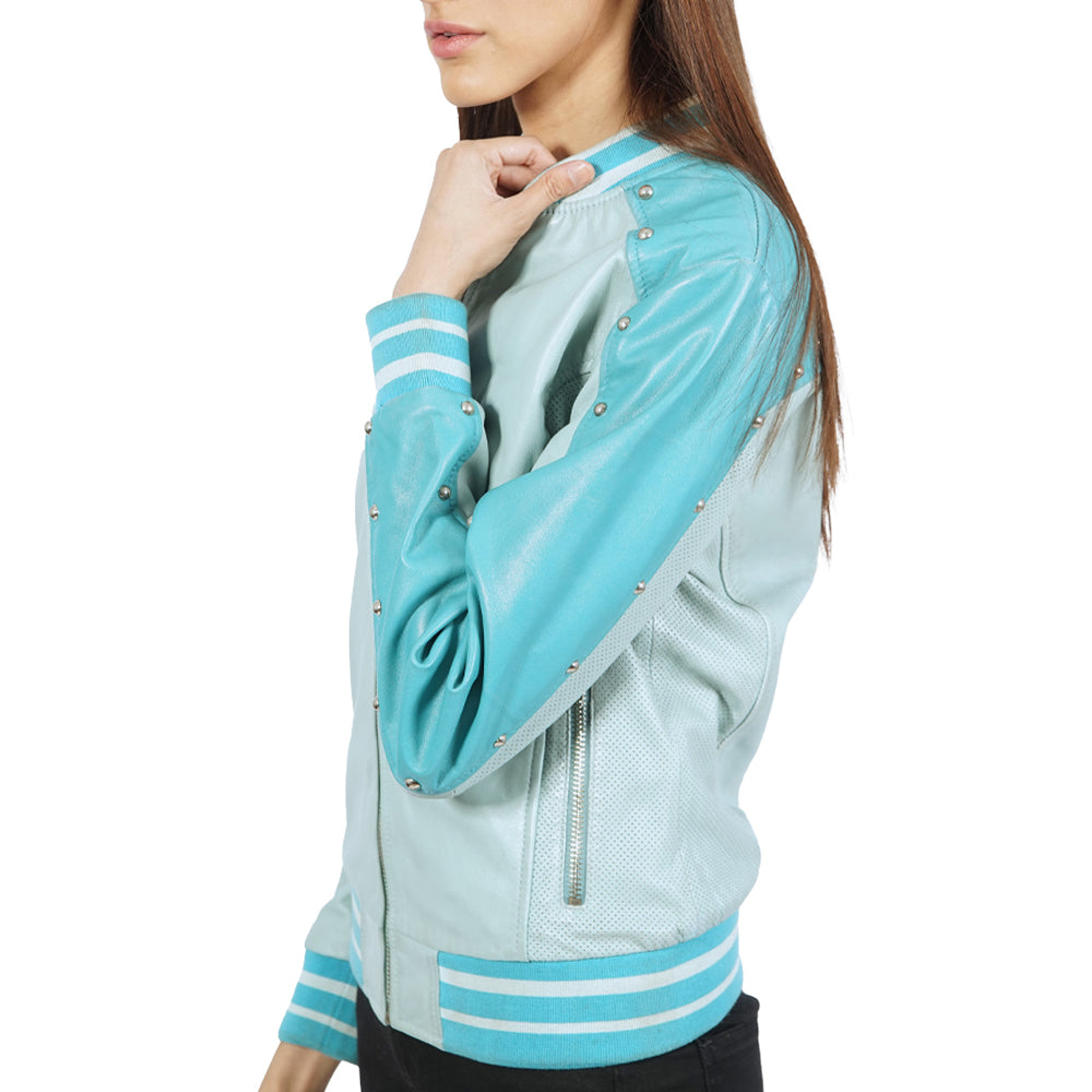 A woman wearing a turquoise leather bomber jacket.